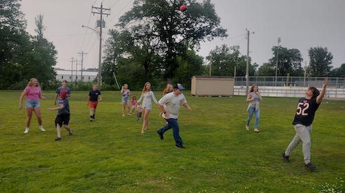 A Group of kids playing football from New Life Church in Aitkin MN